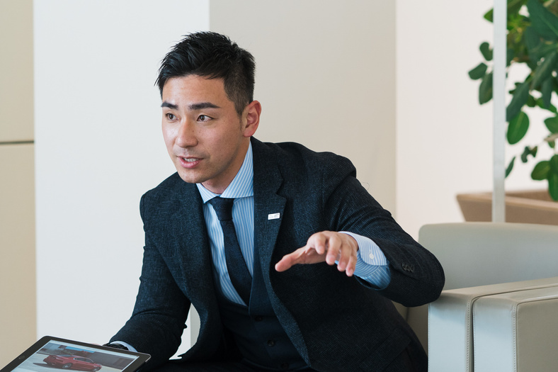 Car Salesperson Presenting to Buyers